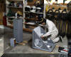 Patrick Wiggins applies a second coat of primer to part of the Grim's declination assembly. A second piece of the assembly awaits painting to the left. 20 JAN 2002 Patricia McWhorter image