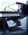 Roger Butz and Bruce Grim load parts of the "Big Scope" for transport to SPOC 2. 01 FEB 2002