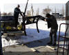 Bruce Grim and Roger Butz unload the cradle for the "Big Scope". 01 FEB 2002